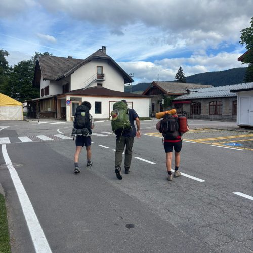 Hikers with backpacks on the Alta Via 1 trail in the Dolomites