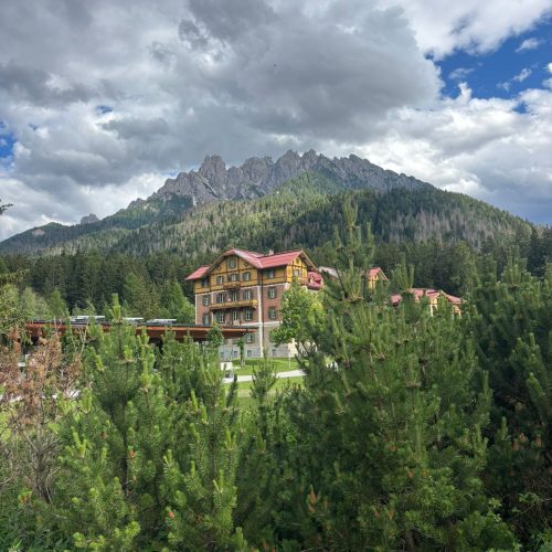 Mountainous landscape with Alta Via 1 lodge in Dolomites