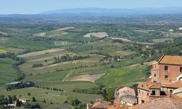 Tuscan landscape with Montepulciano rooftops, Italy