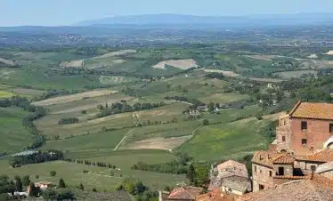 Tuscan landscape with Montepulciano rooftops, Italy
